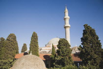 Rhodes Town.  Domed and red tiled rooftops and minaret of Suleyman Mosque against clear blue sky of early summer.AegeancoastcoastalWorld Heritage Siteformer Ottoman territoryOld townlocation fo...