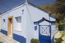 Traditional Greek Islands fishermans cottage on Ixia Beach with blue painted exterior walls and white window shutters.Aegeancoastcoastalformer Ottoman territorylocation for Guns of NavaroneRodi...