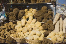 Rhodes Town  Mandraki Harbour.  Tourist souvenir stall on harbourside selling sponges from nearby Symi  in late afternoon sun. AegeancoastcoastalFormer Ottoman territoryearlySummer seasonlocati...