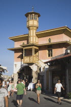 Rhodes Town.  Restored wooden tower of Ottoman era building on main shopping street of Odos Sokratous with tourists walking in late afternoon sunshine.AegeancoastcoastalFormer Ottoman territoryea...