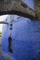Greek  blue painted house in the Old Town with medieval wooden arches preserved.AegeancoastcoastalFormer Ottoman territoryearlySummer seasonlocation of Guns of Navaronepackageholidaytrip De...