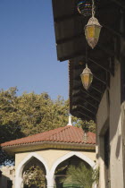 Decorative lanterns hanging from eaves of restored building in Old Town Rhodes.Aegeancoast  coastalFormer Ottoman territoryearly Summer seasonlocation of Guns of Navaronepackage holiday trip De...
