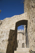 Old Town city walls entrance adjacent to Amboise gate against cloudless blue sky.GreekAegeanCoast - CoastalRodiPackage holidaydestination destinations resortsun sunshine sunnyDestinations Ella...