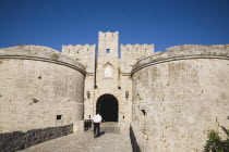 Tourists approaching arched entrance of Amboise Gate entrance to Old Town.GreekAegeanCoast - CoastalRodiPackage holidaydestination destinations resortsun sunshine sunnyDestinations Elladafort...