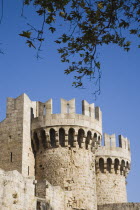 Amboise Gate entrance to the Old Town.  Crenellated  circular towers against clear blue sky.GreekAegeanCoast - CoastalRodiPackage holidaydestination destinations resortsun sunshine sunnyDestin...