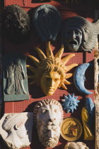 Masks and replica ancient Greek statuary on sale in tourist shop on Odos Sokratous Street in the Old Town.AegeanGreekByzantineRodilocation for Guns of Navaronecoast coastalsun sunshine sunny h...