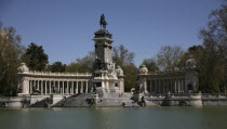 Monument to Alfonso XII in Retiro Park  Parque el Retiro  Lake in Parque Del Buen Retiro.SpainSpanishEspanaIberiaEuropeEuropeanCityParkStatueLakeWaterTouristsTravel Blue Destination Desti...