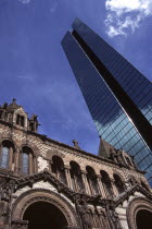 Trinity Church beside the John Hancock Tower.TravelTourismHolidayVacationExploreRecreationLeisureSightseeingTouristAttractionTourDestinationTrinityPresbyterianChurchCopleySquareStree...