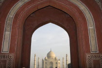 Taj Mahal  through the arch of the Royal or Great Gate.TravelTourismHolidayVacationExploreRecreationLeisureSightseeingTouristAttractionTourDestinationTripJourneyDaytripTheTajMahalPa...