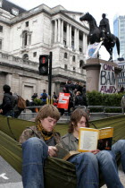 England  London  City  Threadneedle Street  Bank of England G20 Protests  April 2009. Protesters reading book on Spanish Civil War.European UKUnited KingdomGBGreat BritainEuropeEuropeanMeeting...