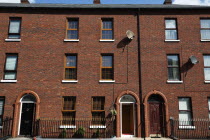 Typical 3 storey terrace in Hamilton Street  near the Markets.Beal Feirste Eire RedBrickSatelite DisEuropean Irish Northern Northern Europe Republic Ireland Poblacht na hEireann Story Three