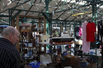 St Georges Market on a busy friday morning  busy with shoppers. Stall selling household Bric a Brac  including a model of the Titanic.Beal Feirste Eire European Irish Northern Northern Europe Republi...