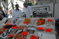 St Georges Market on a busy friday morning  fish vendors with display of locally caught fresh fish for sale.Beal Feirste Eire European Irish Northern Northern Europe Republic Ireland Poblacht na hEir...