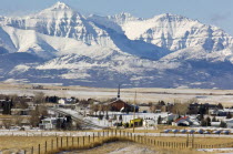 The village of Mountain View population 12 000 and the Rocky Mountains covered in snow. Mormon Church at the centre of this agricultural economyRockies American Canadian Center North America Northern...