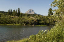 Crowsnest Mountain with river in the foreground.American Canadian North America Northern Blue Scenic