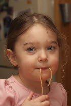 Kylan Stone   3 year old girl  eating spaghetti.American Northern Immature Kids North America One individual Solo Lone Solitary Three United States of America