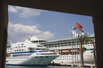 Kusadasi.  Harbour with ferry and cruise ships.  A popular stopping point for Ephesus tours in early Summer.AegeanCoast CoastalSeaHolidayResortport Destination Destinations European Holidaymaker...