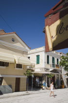 Pythagorio.  Newly renovated main shopping street in town.  with awning shades pulled out over shop fronts on bright summer afternoon with early season tourists.North Eastern AegeanGreek IslandsPit...