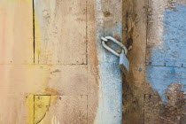 Detail of padlocked wooden doorway with patches of faded blue and yellow paint.AegeanGreek IslandsSimicoast coastalseaSummerpackageholidayresortvacationtripdestinationDestinations Ellada...