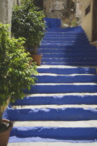 Flight of blue painted stone steps leading from Yialos harbour uphill to Chorio village. AegeanGreek IslandsSimicoast coastalseaSummerpackageholidayresortvacationtripdestinationDestinatio...