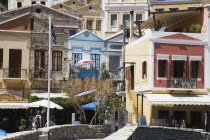 Yialos.  Painted facades of waterfront houses.Destination Destinations Ellada European Greek Southern Europe
