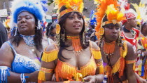 Nottinghill Carnival revellers in colourful costumes.Colorful European Great Britain Holidaymakers Londres Northern Europe Tourism Tourist UK United Kingdom British Isles Sightseeing Tourists