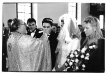 Traditional Greek Wedding. Priest offering Groom wine  during ceremony.Marriage Marrying Espousing Hymeneals Nuptials Religion Religious Christianity Christians Vino Vin Alcohol Grape Winery Drink Cl...