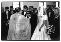 Traditional Greek Wedding ceremony. Groom bending over to kiss Priest s ring.Classic Classical European Marriage Religion Religion Religious Christianity Christians Marriage Marrying Espousing Hymene...