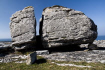 Close up of a large limestone boulder split in two by the force of nature.Eire European Irish Northern Europe Republic Ireland Poblacht na hEireann 2 Blue Gray Karst Sedimentary Rock Scenic