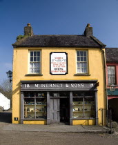 The Village Street denotes village life in 19th century Ireland  McInerney & Sons ironmongers shop.Eire European Irish Northern Europe Republic Ireland Poblacht na hEireann Blue Gray History Historic...