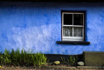 Colourful blue wall on Cashen Fishermans House.Eire European Irish Northern Europe Republic Ireland Poblacht na hEireann Colorful History Historic