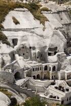 Turkey, Cappadocia, Goreme, Cave hotel in hillside.