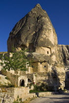 Turkey, Cappadocia, Goreme, Cave dwellings still used as homes and stores.