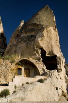 Turkey, Cappadocia, Goreme, Cave dwelling wth visible erosion of wall.