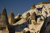 Turkey, Cappadocia, Goreme, Cave dwellings set into hillside.