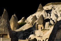 Turkey, Cappadocia, Goreme, Cave dwellings set into hillside.