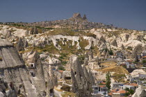 Turkey, Cappadocia, Goreme, Cave hotel and view towards Uchisar.