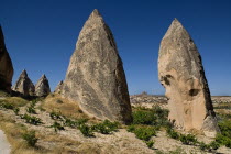 Turkey, Cappadocia, Goreme, Sword Valley, The valley got its name because of all the sharp pinnacles to be found there. The hilltop town of Uchisar can be seen in the background.