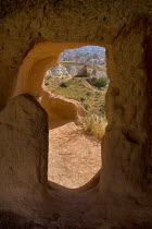 Turkey, Cappadocia, Goreme, Red Valley, View through a window adjacent to Hacli Kilise.