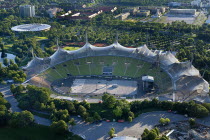 Germany, Bavaria, Munich, Olympic Stadium, Olympiastadion, Built as the main venue for the 1972 Summer Olympics, Large sweeping canopies of acrylic glass stabilised by steel cables meant to represent...