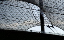 Germany, Bavaria, Munich, Olympic Stadium, Olympiastadion, Built as the main venue for the 1972 Summer Olympics, Large sweeping canopies of acrylic glass stabilised by steel cables meant to represent...