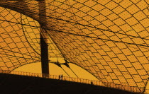 Germany, Bavaria, Munich, Olympic Stadium, Olympiastadion, Built as the main venue for the 1972 Summer Olympics, Large sweeping canopies of acrylic glass stabilised by steel cables meant to represent...