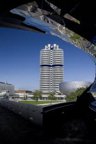 Germany, Bavaria, Munich, BMW Headquarters and museum reflected in BMW Welt, World.