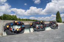 Germany, Bavaria, Munich, Dachau World War II Nazi Concentration Camp Prisoner badges memorial, Communists were given red triangles, Jews yellow ones and foreign workers got the blue triangle.