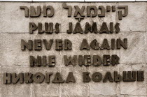 Germany, Bavaria, Munich, Dachau World War II Nazi Concentration Camp, A hopeful wish for the future written in Hebrew, French, English, German and Russian.