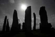 Silhoetted Callanish Standing Stone Circle.European Standing stonesstone circleancientmystic Alba Blue Gray Great Britain History Historic Northern Europe UK United Kingdom