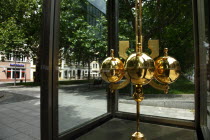 Neustadt  Hauptstrasse  Golden pendulum of clock in the pedestrianised area.Destination Destinations Deutschland European History Holidaymakers Sachsen Tourism Tourist Western Europe Saxony Sightseei...