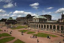 Zwinger Palace and ornamental gardens. Built 1710-1732  designed by Matthaus Daniel Poppelmann.Destination Destinations Deutschland European History Holidaymakers Sachsen Tourism Tourist Western Europe Saxony Sightseeing Tourists Blue Clouds Cloud Sky Garden Plants Flora Gray History Historic  Destination Destinations Deutschland European History Holidaymakers Sachsen Tourism Tourist Western Europe Saxony Sightseeing Tourists Blue Clouds Cloud Sky Garden Plants Flora Gray History Historic