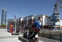 Gun Wharf Quay. Canalside mast head figure with new apartment block tower in the background.Red Telephone Box Gunwharf Blue European Great Britain Holidaymakers Northern Europe Tourism Tourist UK Uni...