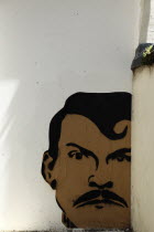 England, East Sussex, Brighton, Little East Street, Mural of mans Head sprayed on wall.